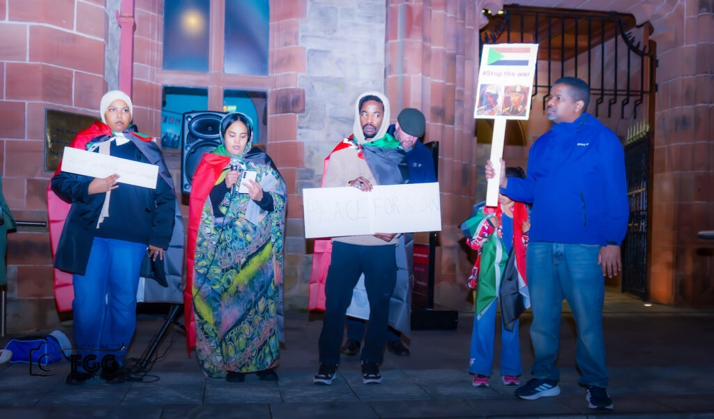 Members of the local Sudanese community who held a vigil in Guildhall Square