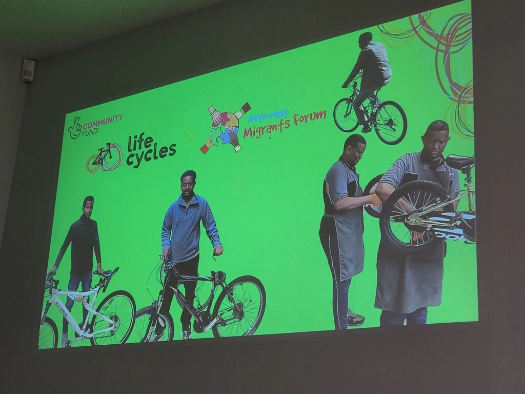 The North West Migrants Forum getting the big screen treatment at the recent Life Cycles AGM.