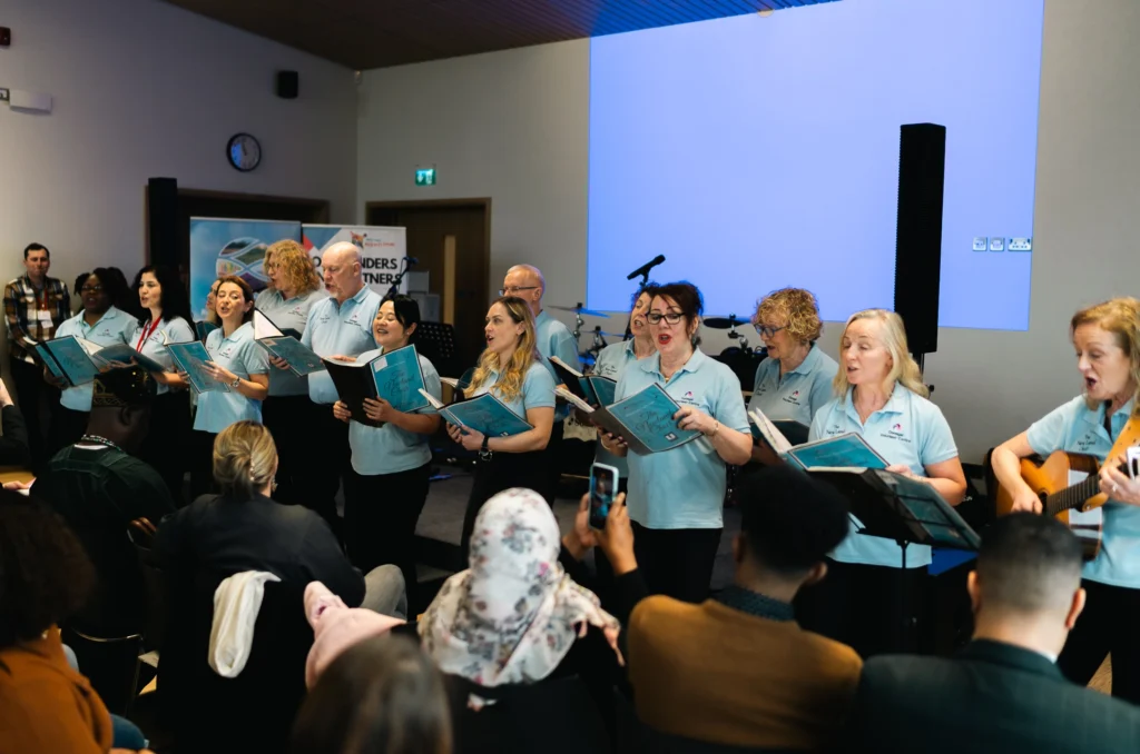 The New Land Choir who travelled from Donegal to perform at the launch of the ICI Programme. - North West Migratnts Forum.