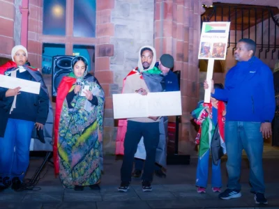 Members of the local Sudanese community who held a vigil in Guildhall Square