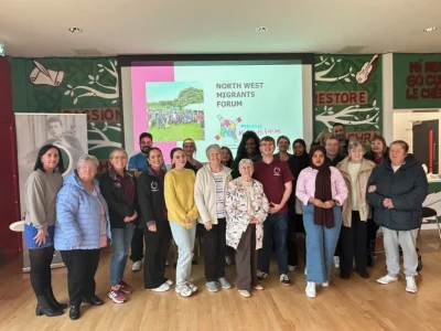 NWMF staff and volunteers with members of the Creggan Neighbourhood Partnership in Seán Dolans GAA Club